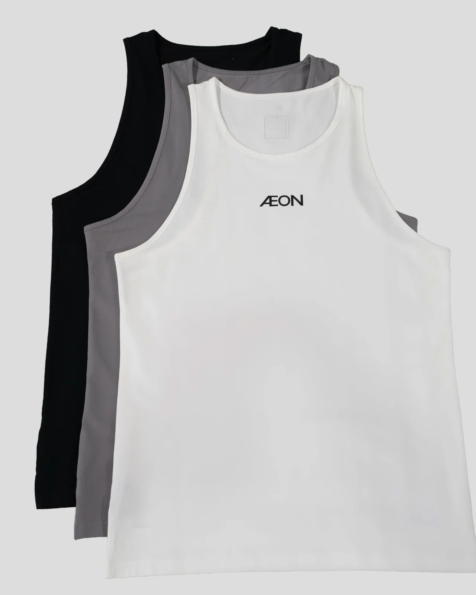 Three tank tops in black, gray, and white with 'AEON' branding on a light gray background.