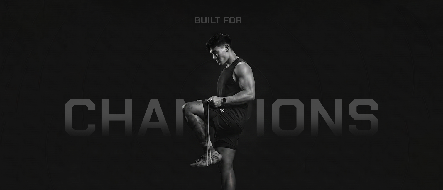 Person lifting weights with 'BUILT FOR CHAMPIONS' text in the background